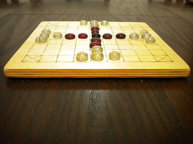Close-up of 25-piece Hnefatafl Game, set out for play.