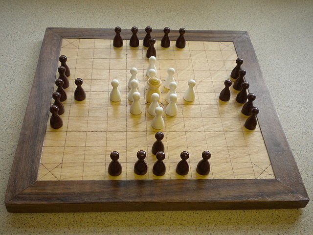Compact 11x11 board, with reversed pieces.